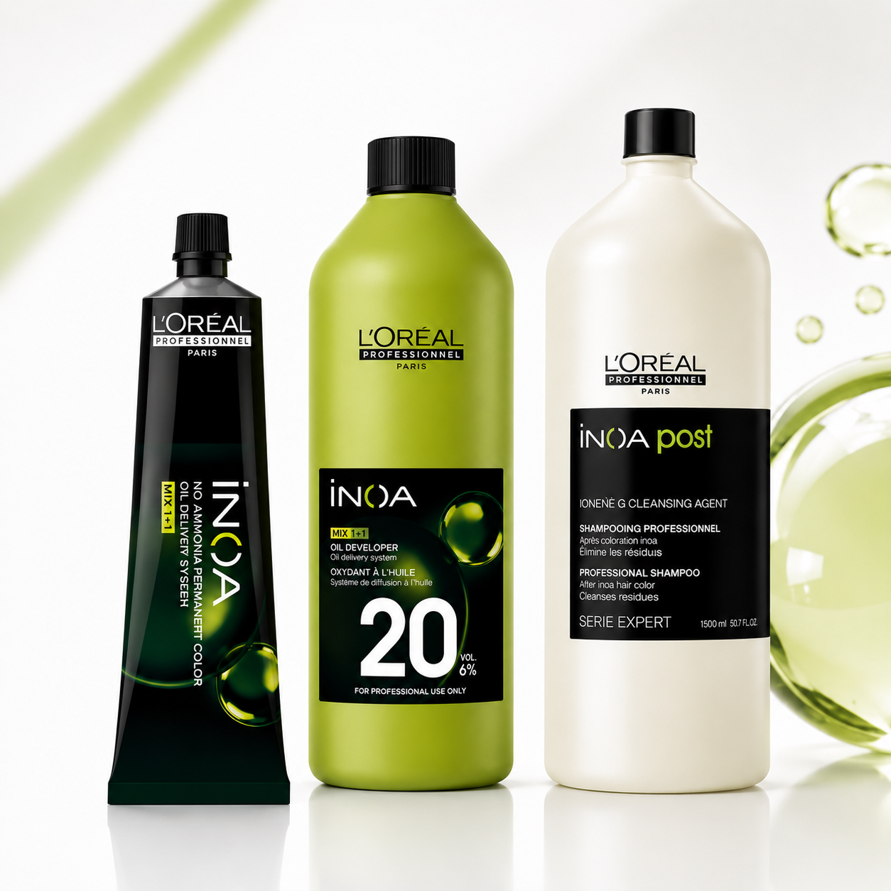 L'Oréal Professionnel INOA colour tube, developer and post-colour shampoo displayed on a clean white background with subtle green accents.