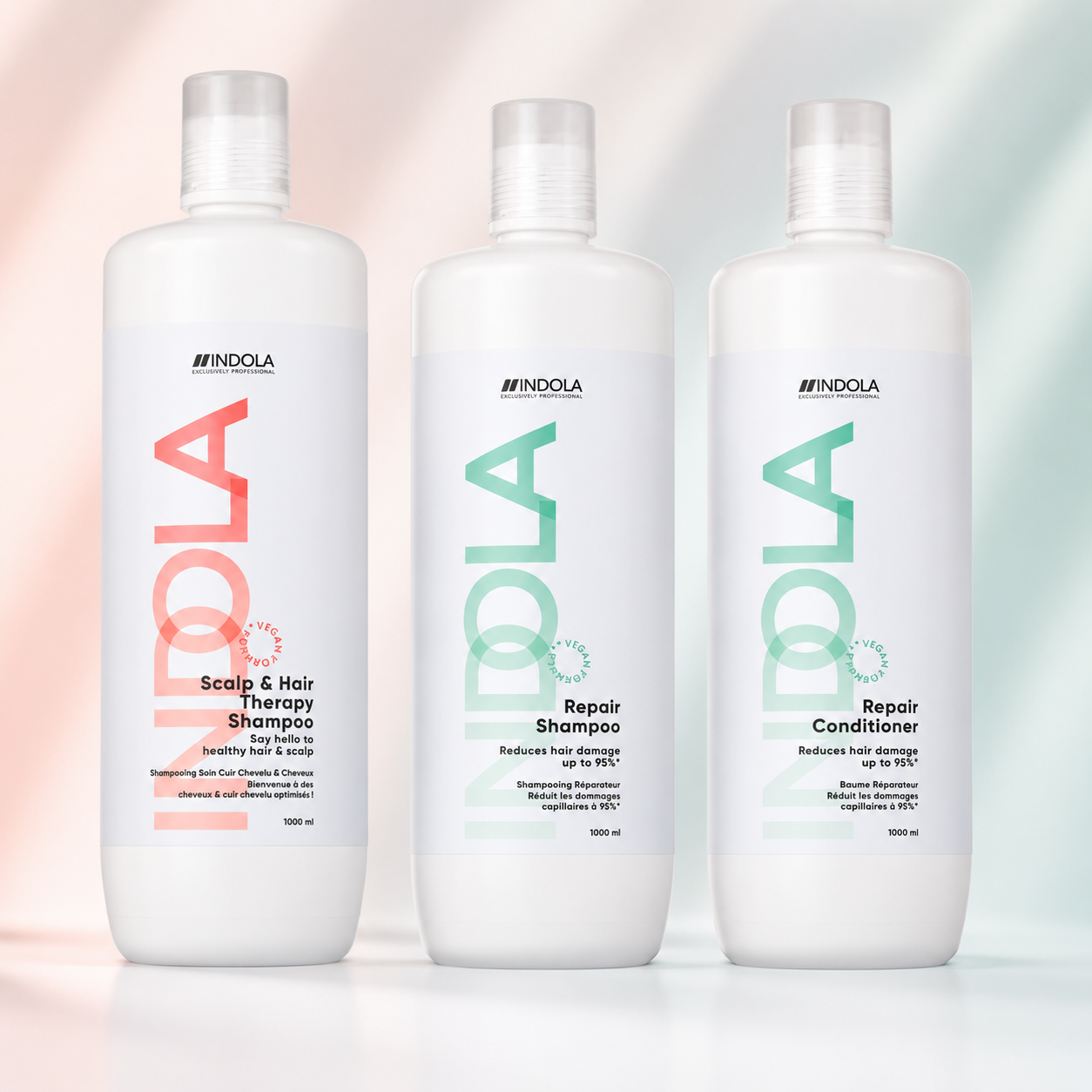 Indola Scalp & Hair Therapy and Repair products displayed on a soft peach and mint gradient background.