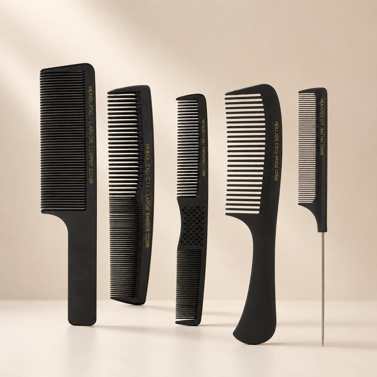 Selection of Head Jog professional barbering, cutting and styling combs displayed on a clean premium beige background.